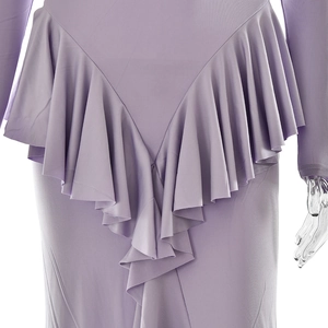 Detailed view of the purple dress featuring elegant ruffled pleats and high-quality fabric texture