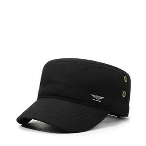 Detail of black military flat top cap with silver eagle badge and ventilation eyelets