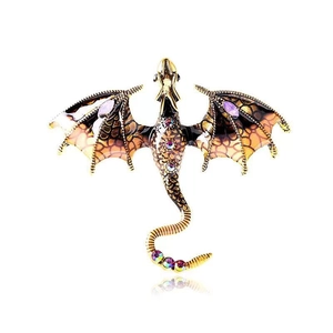 Detail of dragon brooch with colorful rhinestones and enamel wings on golden metal
