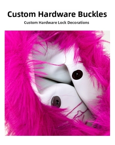 Close-up of metal magnetic snaps on white faux leather with bright pink faux fur trim