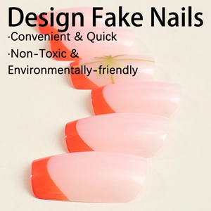 Pale pink press on nails with bright orange French tips and green star accents