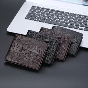 Men's vintage crocodile pattern short wallets in four colors on an office laptop