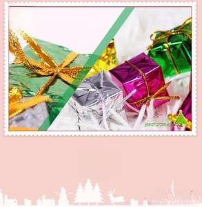 Close-up of colorful foam Christmas gift box ornaments with shiny foil and decorative ribbons