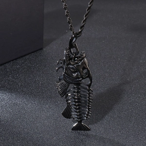 Macro shot of black metallic fishbone pendant with detailed skeletal texture on rope chain