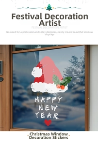 Close-up of Christmas hat and Happy New Year decals on a glass window display