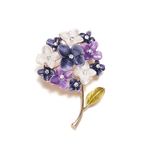 Close-up of enamel hydrangea brooch with purple petals and small rhinestones