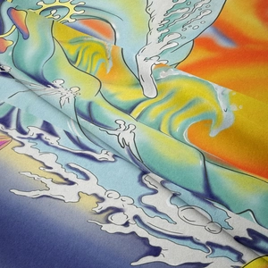 Close-up of psychedelic tarot tapestry fabric showing vibrant wave patterns and sun detail