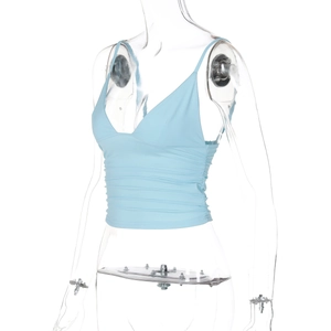 Detail of blue cropped tank top showing ruched fabric texture on a mannequin