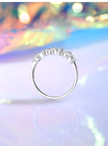 Detail of S925 sterling silver ring with rectangular baguette-cut diamonds in silver