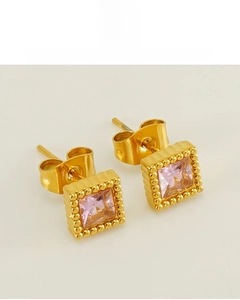 Detailed close-up of gold-plated square purple zircon stud earrings with beaded edge