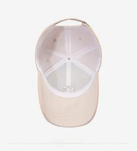 Detailed interior view showing breathable lining and stitching of the beige baseball cap