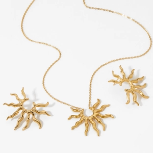 Golden stainless steel sunburst jewelry set with necklace and matching stud earrings