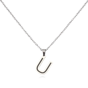 Macro shot of silver stainless steel pendant featuring a modern capital letter U design