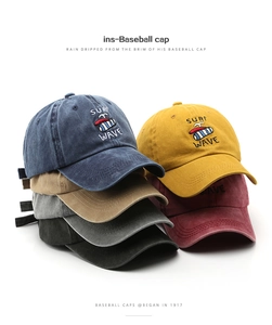 Close-up of assorted vintage washed cotton baseball caps featuring Surf Wave embroidery