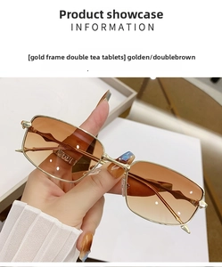 Detail view of golden metal square sunglasses with double brown gradient lenses