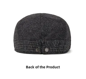 Rear view of a dark grey wool newsboy hat featuring textured fabric and plaid detailing