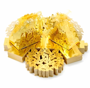 Detailed laser-cut butterfly wedding candy boxes in gold with elegant silk ribbon