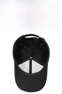 Close-up of black breathable mesh baseball cap with adjustable strap and interior details