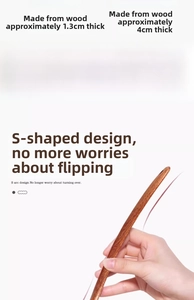 Detail view of S-shaped curved wooden spatula with ergonomic long handle design