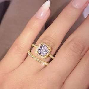 Chic 18K gold plated two-piece ring set featuring a radiant cut cubic zirconia halo design