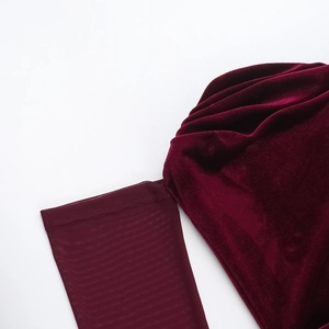 Close-up of wine red velvet and mesh splicing with pleated texture on the sleeve