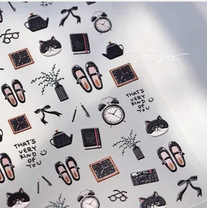 Close-up of black cat and French retro embossed nail stickers with 3D texture details