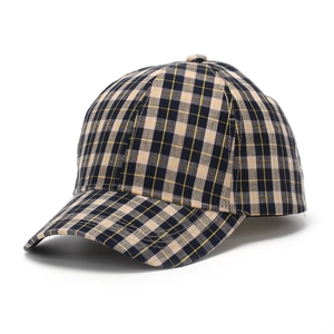 Detailed view of the plaid pattern and curved brim on a stylish checkered baseball cap