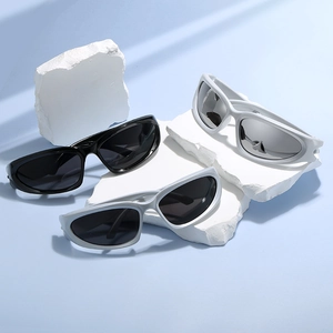 Futuristic cyberpunk sports sunglasses in black, white and grey on stone display