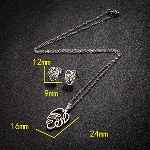 Silver stainless steel jewelry set featuring hollow palm leaf necklace and stud earrings