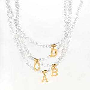 Elegant white pearl necklace with golden initial alphabet pendant for women