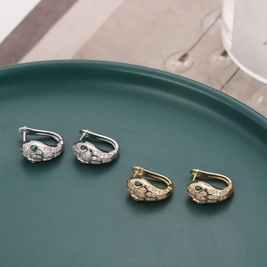 Snake-shaped hoop earrings with sparkling zircon crystals in gold and silver finish
