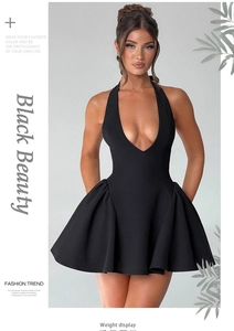 Detail of a sexy black mini dress featuring a deep V-neckline and elegant halter neck design