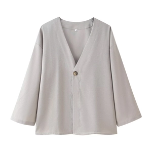 Detailed close-up of grey V-neck linen cardigan featuring single button and S size label