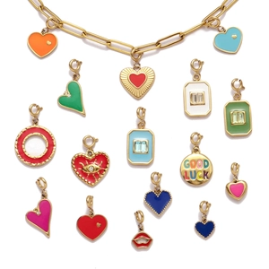 Golden bracelet set with colorful enamel heart charms and evil eye pendants