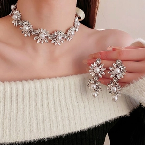 Sparkling sunflower jewelry set with pearl necklace and drop earrings on model