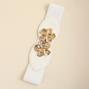 Detail of white elastic waist belt with gold floral buckles and faux leather leaf accents