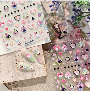 Detailed view of 3D embossed rabbit nail stickers with playing card patterns on nails