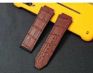 Detail of brown alligator grain leather strap with black rubber lining for watches