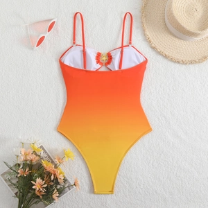 Costume da bagno intero sfumato arancione con dettaglio a stella marina e accessori estivi