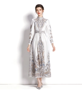Close-up of paisley print dress with high collar and lantern sleeves detail