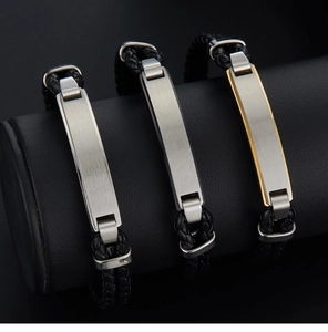 Close-up of multi-layer braided leather bracelets with brushed metal plates in three colors
