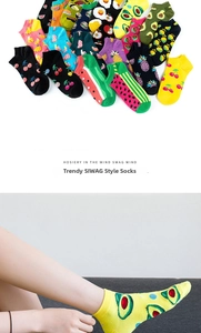 Detail of colorful fruit pattern ankle socks showing cherry and pineapple prints