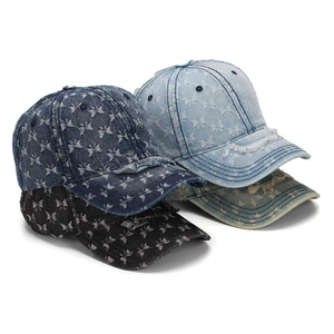 Distressed denim baseball caps with butterfly print in various vintage washes