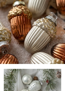 Detailed macro view of bronze acorn and gold ball ornaments on a natural pine branch