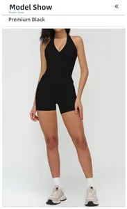 Premium black brushed yoga set featuring a halter V-neck vest and tight athletic shorts