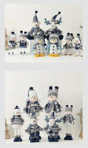 Close-up of blue plaid knit hats and scarves on snowman and reindeer plush toys