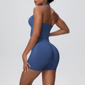 Detail view of seamless dark blue yoga set featuring a halter top and high-waist lifting shorts