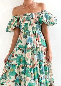 Detail of puff sleeves and floral pleated bust on summer off-shoulder dress