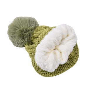 Thick grass green cable knit beanie with fluffy pom-pom and warm white fleece lining