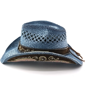 Detailed embroidery and sequins on the brown suede brim of a denim blue straw cowboy hat